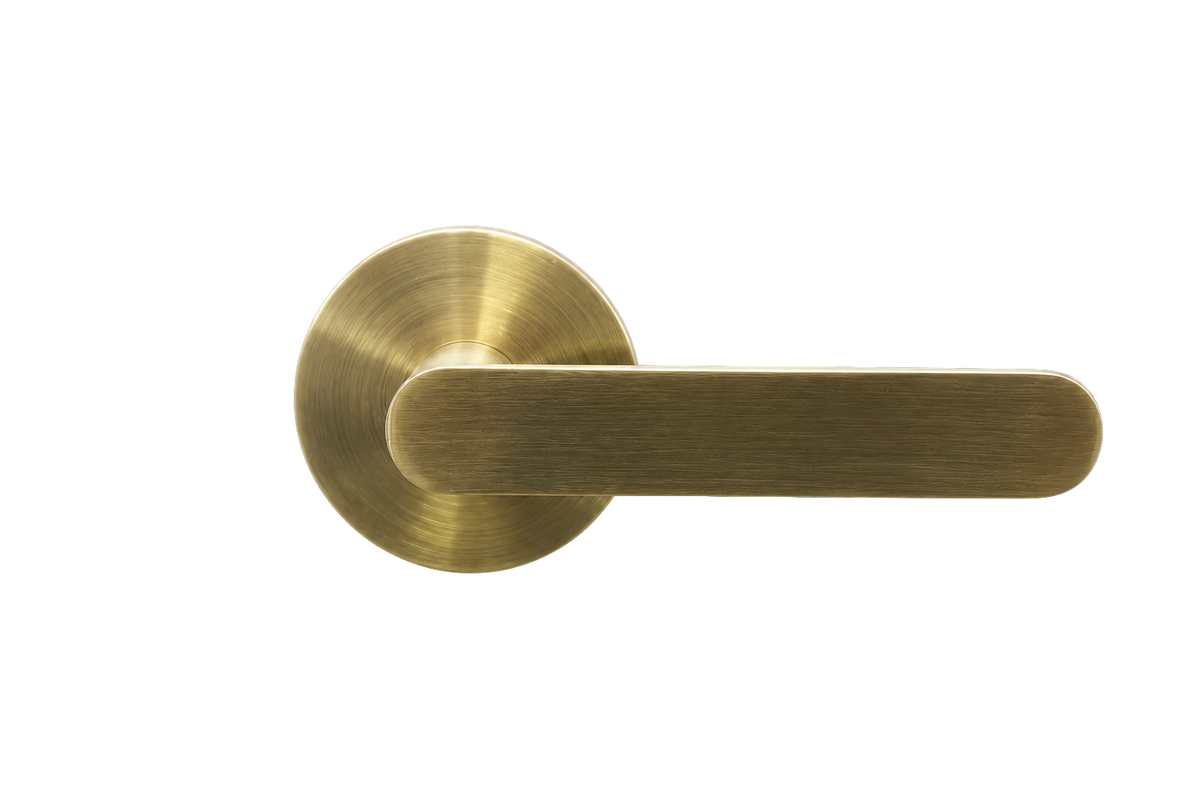 Gold door handle on a white background